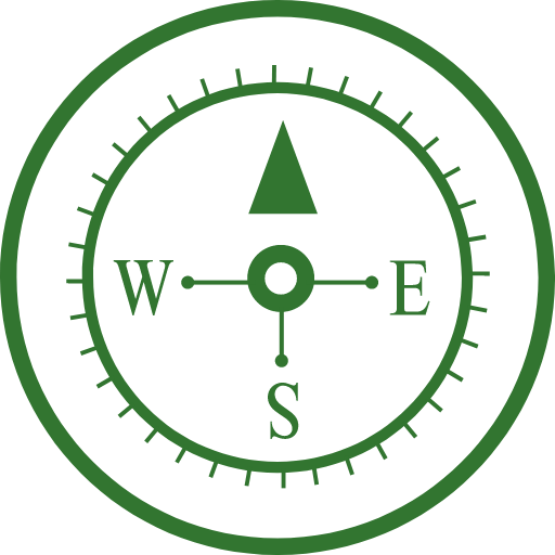 A green compass in a black circle.